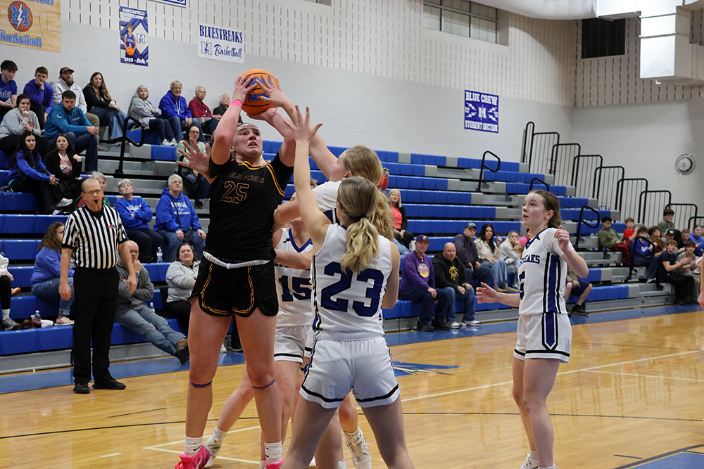 Lucy Moore rises up for two points over the Martinsville defense. Moore powered the Lady Warriors with a double-double, recording 15 points and 12 rebounds. —photo by Terri Cox